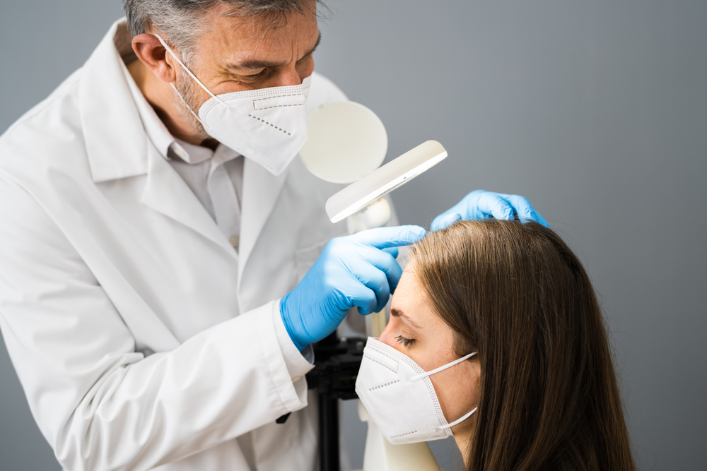 Dermatologist,Doctor,Checking,Woman,Hair,For,Dandruff,In,Face,Mask